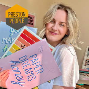 Claire with her art and Preston People Logo